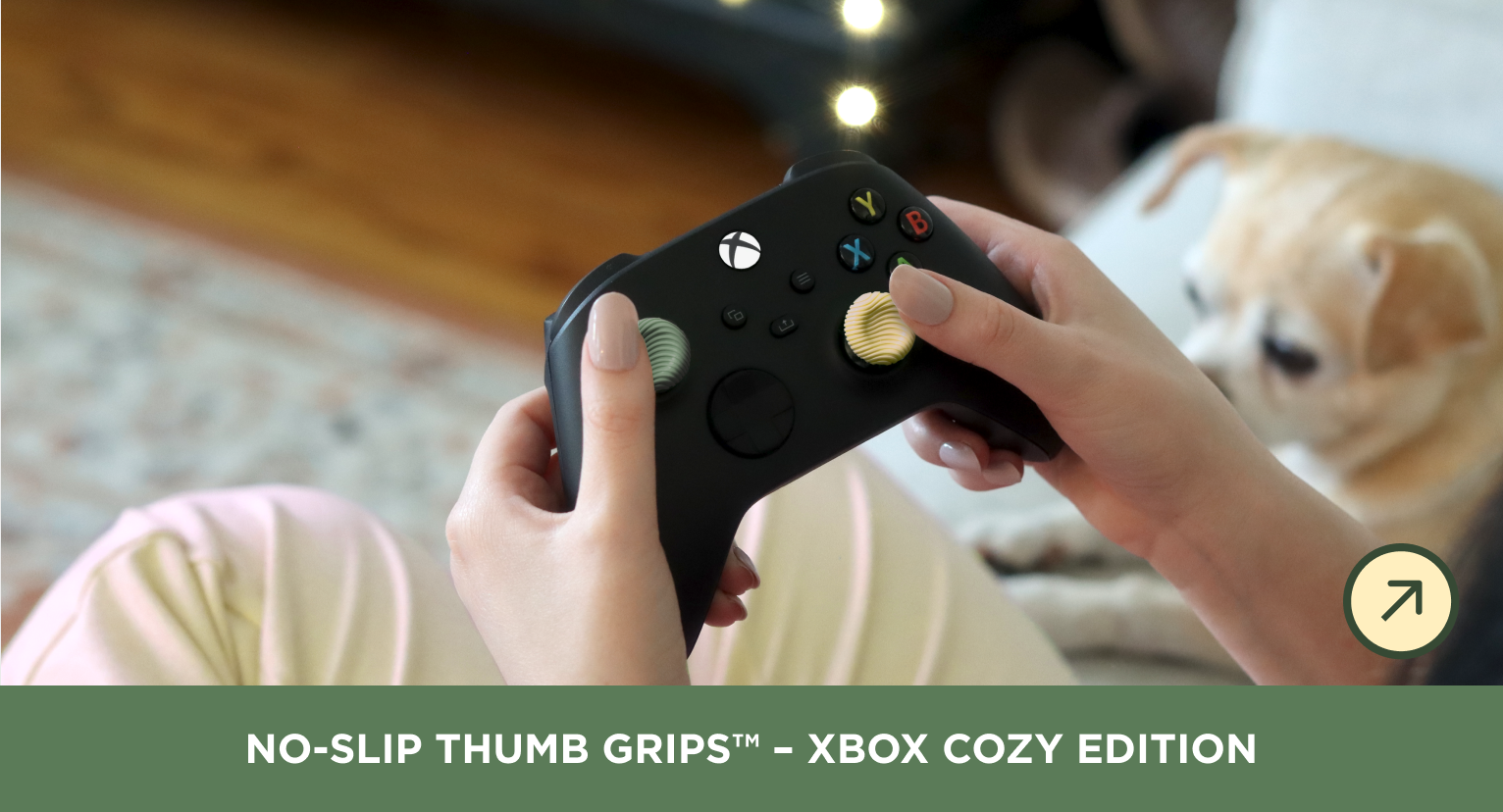 A person holding a black Xbox controller with textured no-slip thumb grips, with a small dog blurred in the background and a text banner at the bottom reading 'NO-SLIP THUMB GRIPS - XBOX COZY EDITION'.